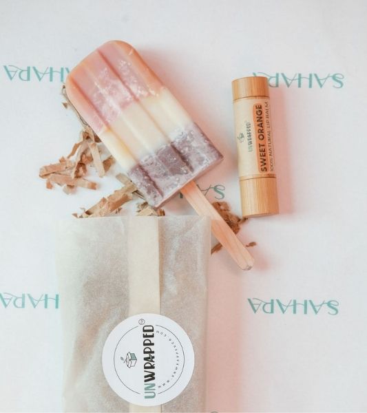 Unwrapped soapsicle and lip balm. 
