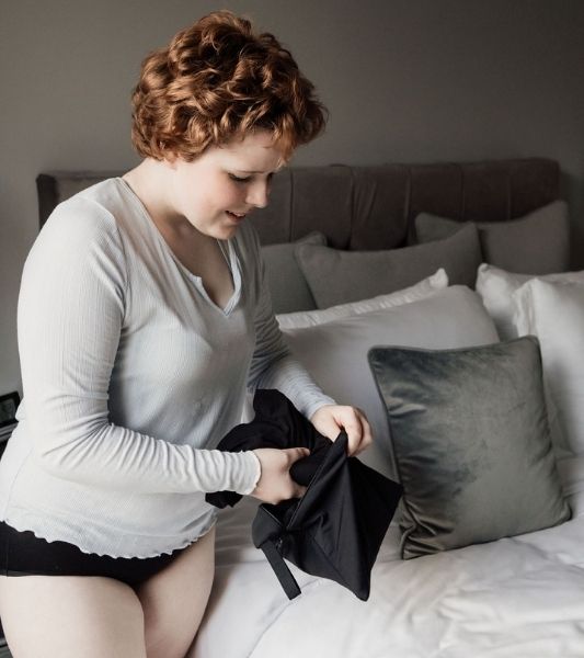 Teen using waterproof wet dry bag for Sahara period pants