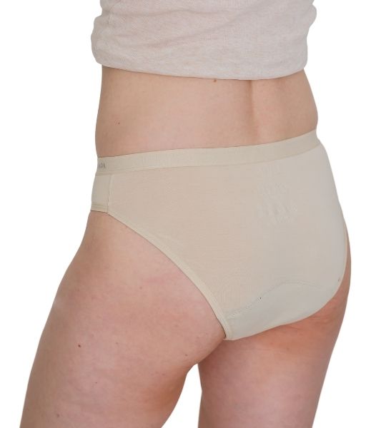 Sahara beige period pants worn by a woman on a white background