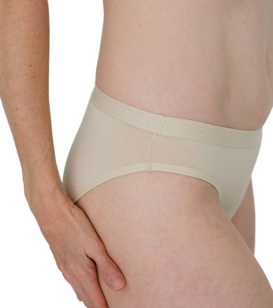 Sahara. beige period underwear worn by a woman on a white background. Side view. 