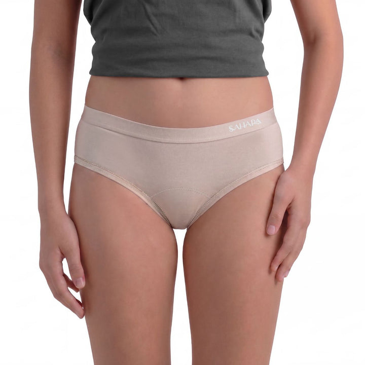 Model wearing beige Sahara teen period panties - can be worn under white school uniform &amp; PE kit