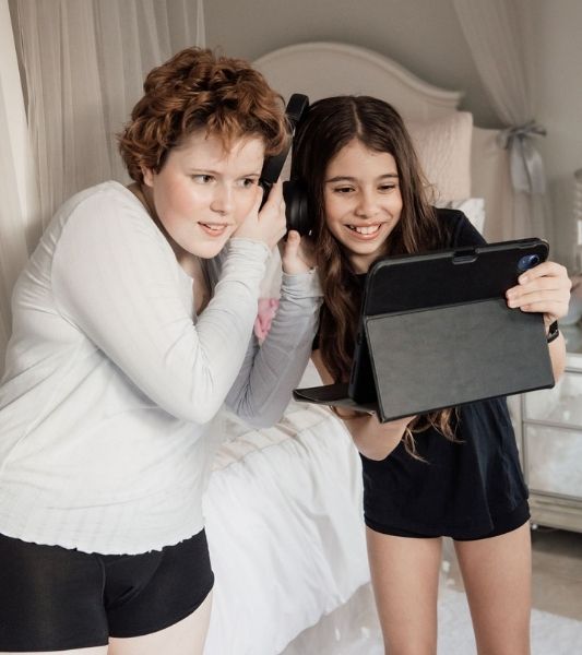 Two teens wearing black teen boyshort period pants front view - heavy flow